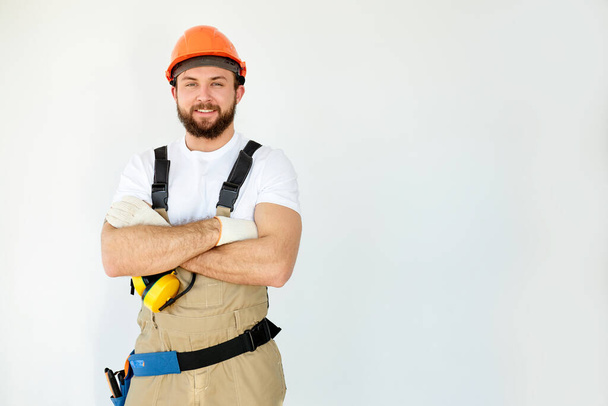 Portrait of handsome mechanic with beard in overall, shirt having arms crossed - Φωτογραφία, εικόνα