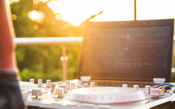 Dj mixing music outdoor. DJ stands near the control panel. - Fotoğraf, Görsel