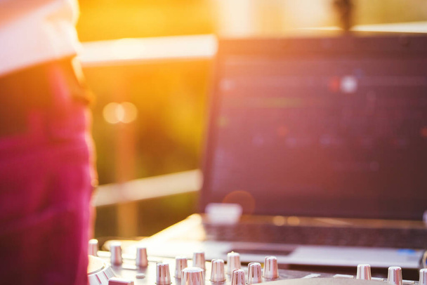 Dj mixing music outdoor. DJ stands near the control panel. - Φωτογραφία, εικόνα
