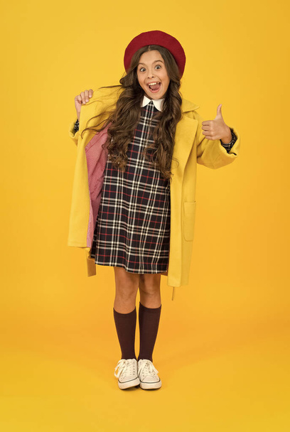 best day ever. wearing autumn raincoat. back to school. retro girl wear uniform and parisian beret. kid school fashion. cheerful child ready for schoolyear. education. knowledge day. happy childhood - Photo, image