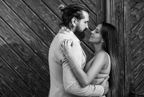 First meet. bearded man hipster hug sexy woman. guy embrace his girl outdoor. couple in love. feel the romance. first meet date. celebrate romantic holiday. family anniversary. pure feelings - 写真・画像