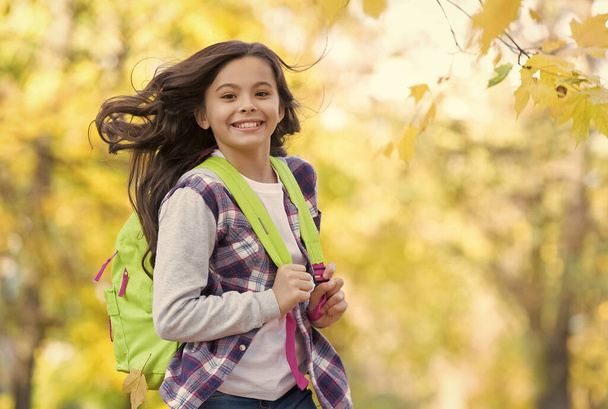 Learning today for better tomorrow. Happy child carry backpack in autumn park. School education. Child care and childhood. Growth and development. International childrens day. November 20 - Φωτογραφία, εικόνα