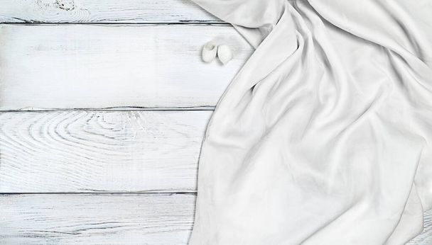 White silk fabric on white wooden background with copy space - Fotoğraf, Görsel