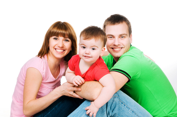 happy family with a baby on a white background - Foto, Bild