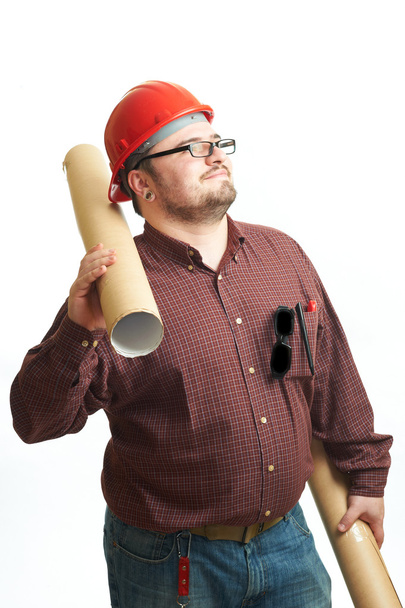 Serious builder in glasses and red hard hat with engineering drawing isolated on white - Φωτογραφία, εικόνα