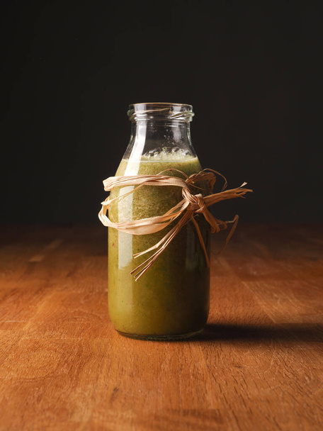 Healthy vegetable fruit smoothie from organic ingredients on a wooden kitchen table - Foto, imagen