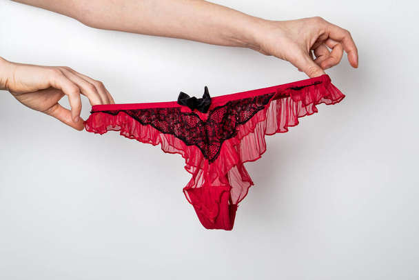 Womens hygiene and health. Red womens underwear. Glamorous and beautiful concept - Photo, Image