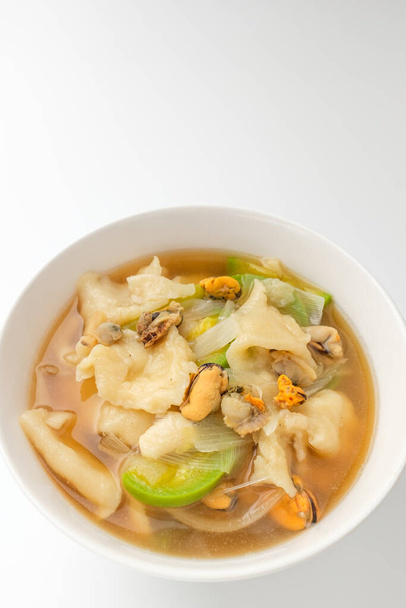 Cooking broth made from flour dough. Seafood soup dish. Vegetable soup dish - Photo, Image