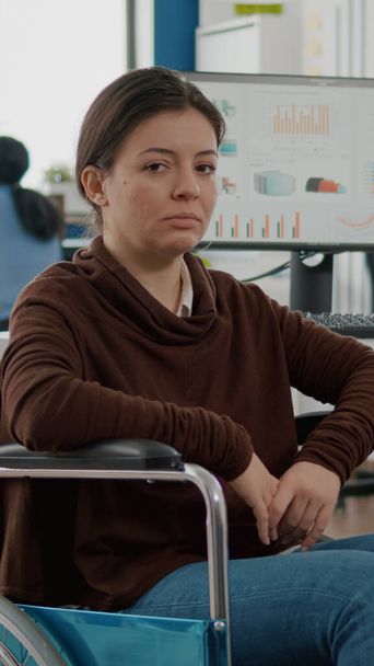 Portrait of immobilized paralyzed tired woman looking at camera - Фото, зображення