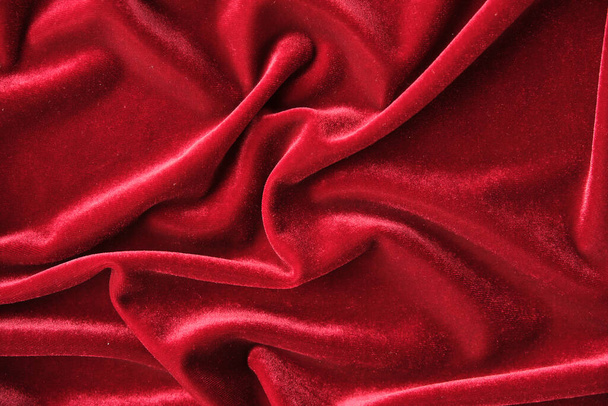 abstract texture of draped red velvet background. eautiful textile backdrop. Close-up. Top view - Photo, Image