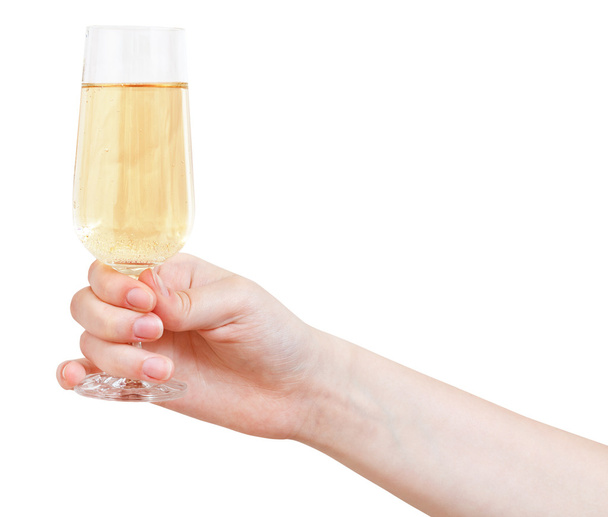 Hand holds wineglass with sparkling wine - Photo, Image