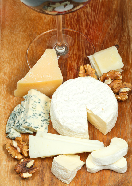glass of red wine and assorted cheeses - Photo, image