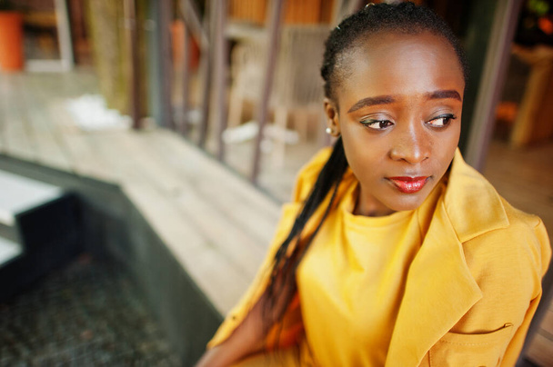 Portrait of nice-looking fashionable attractive lovely content cheerful cheery african american girl wear bright vivid shine vibrant yellow color jacket or costume. - Fotoğraf, Görsel