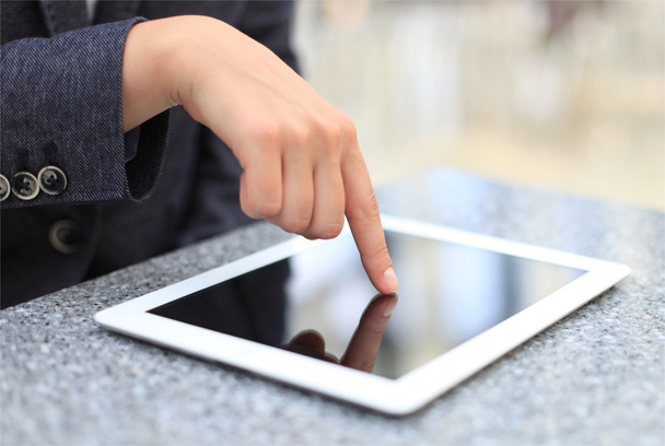 Woman hand touching screen on modern digital tablet pc - Photo, Image