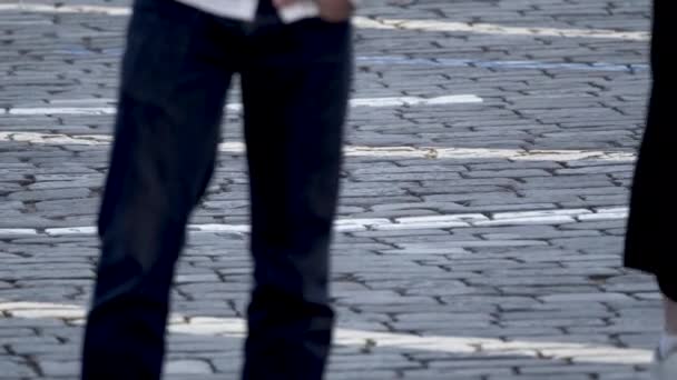 Paving stones on the square on which people are walking. - Filmagem, Vídeo