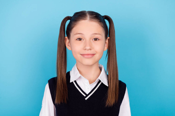Photo of cute little brunet girl wear white shirt vest isolated on blue color background. - 写真・画像