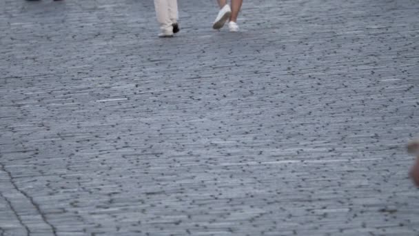 Paving stones on the square on which people are walking. - Filmagem, Vídeo