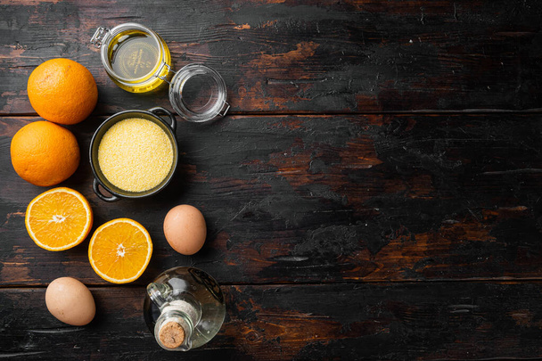 Домашні інгредієнти апельсинового торта, з яйцями та медовим набором, на старому темному дерев'яному фоні столу, вигляд зверху плоский, з місцем для тексту
 - Фото, зображення