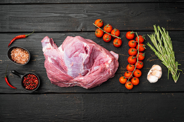 Fresh meat with herbs, oil and spices set, on black wooden table background, top view flat lay, with copy space for text - Φωτογραφία, εικόνα