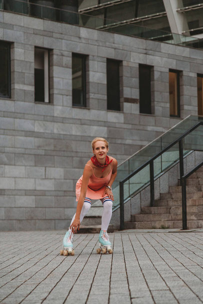 Stylish young woman with vintage roller skates outdoor - Φωτογραφία, εικόνα