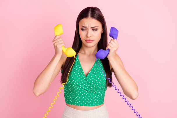 Photo portrait woman in green top talking on telephone wrong number isolated pastel pink color background - Foto, Bild