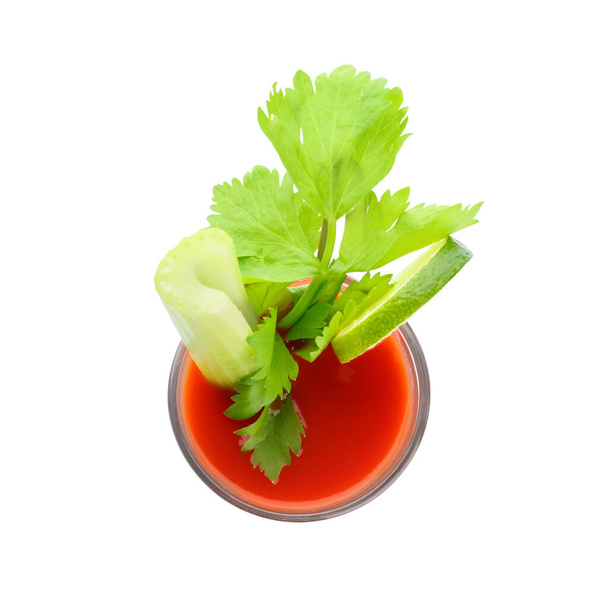 Glass of bloody mary cocktail garnished with cilantro and lime on white background - Photo, Image