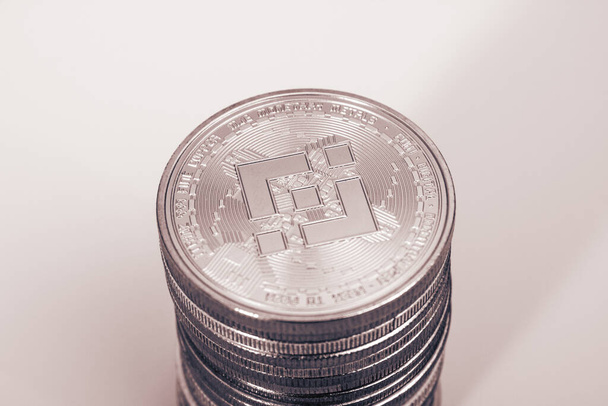 Stack of binance coins over gray background - Foto, Imagen