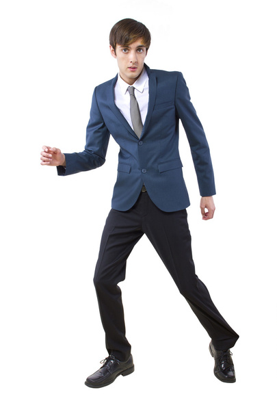 Businessman held back by imaginary obstacle pulling on leg - Photo, image