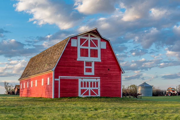 Vintage red barn in a farmyard on the prairies in Saskatchewan  - Photo, Image