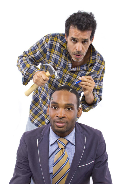 Mechanic or handyman fixing loose screws on male head - Valokuva, kuva