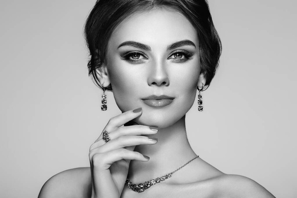 Portrait beautiful woman with jewelry. Model girl with manicure on nails. Beauty and Accessories. Black and white photo - Foto, Bild