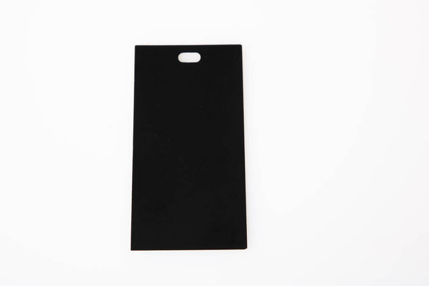 cartón de ropa etiqueta en blanco negro aislado sobre fondo blanco vacío - Foto, imagen
