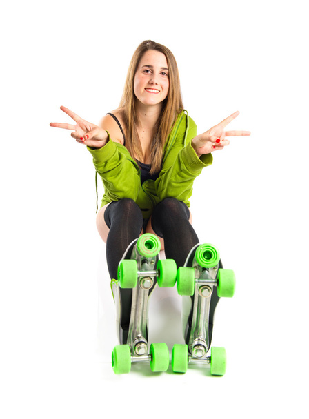 Pretty young girl wearing urban style with roller-skates - Fotografie, Obrázek