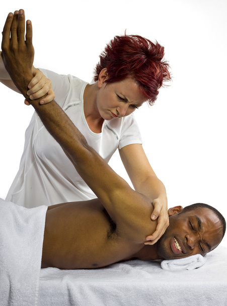 Female masseuse hurting patient - Fotoğraf, Görsel