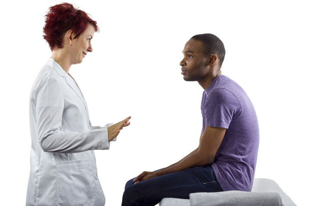 Therapist consulting male about posture - Fotoğraf, Görsel