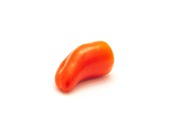 One vibrant red mini sweet pepper isolate on white background. Tiny mini snack peppers are sweeter than average bell pepper. - Photo, Image