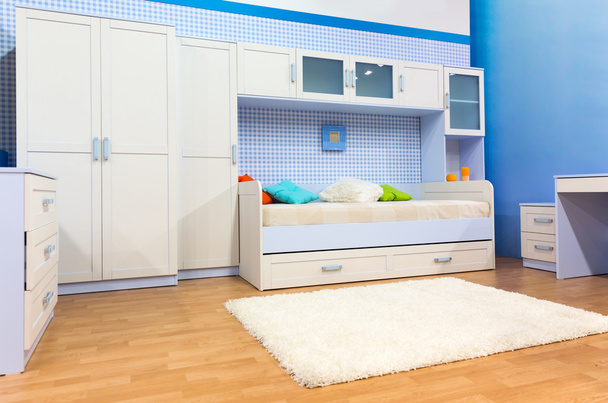 Bright bedroom with a bed and cupboard - Photo, Image