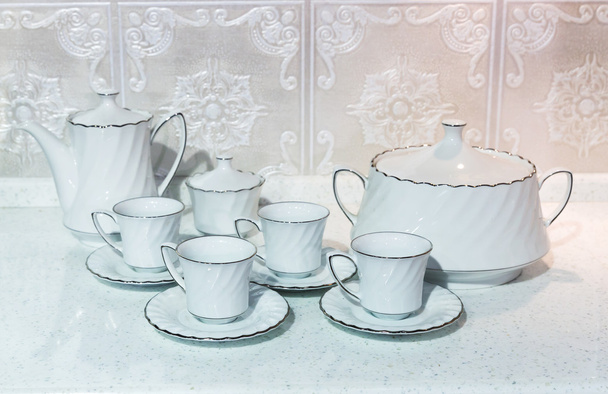 Tazas de té con una tetera
 - Foto, Imagen