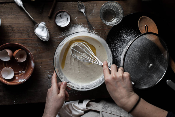 A closeup shot of the process of cooking pancakes - Fotó, kép