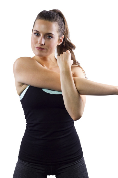 Female fitness trainer is stretching - Фото, зображення