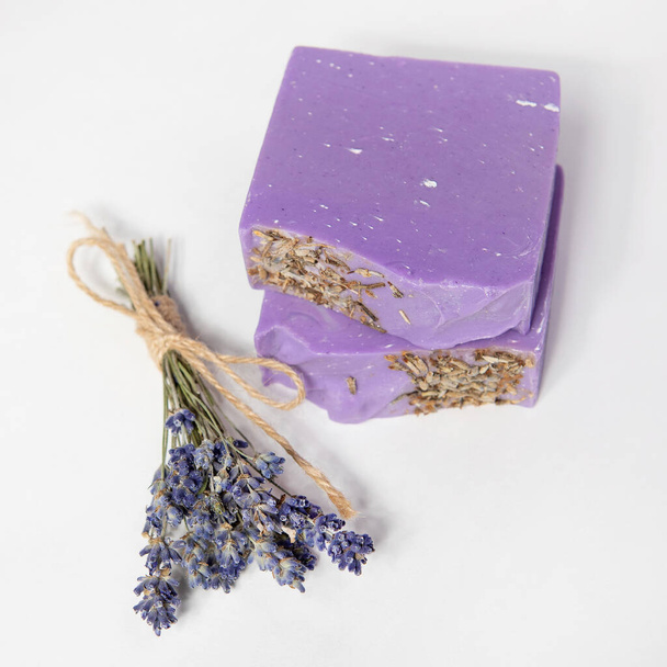 Homemade handmade soap. Bundle of lavender. Small business, organic products, natural ingredients. Top view. - Photo, Image