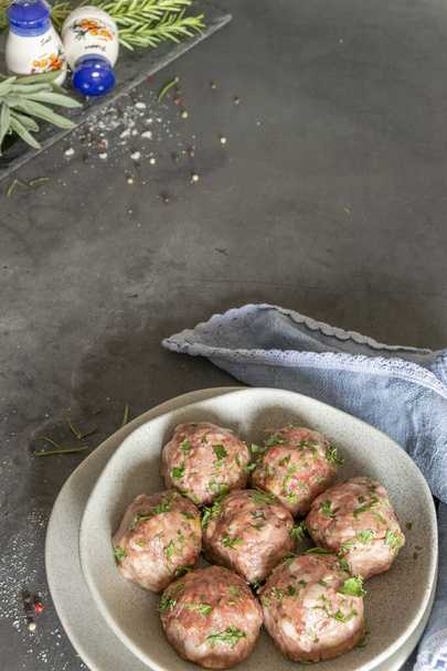 Fresh raw meatballs, minced beef meat on black background - Fotografie, Obrázek