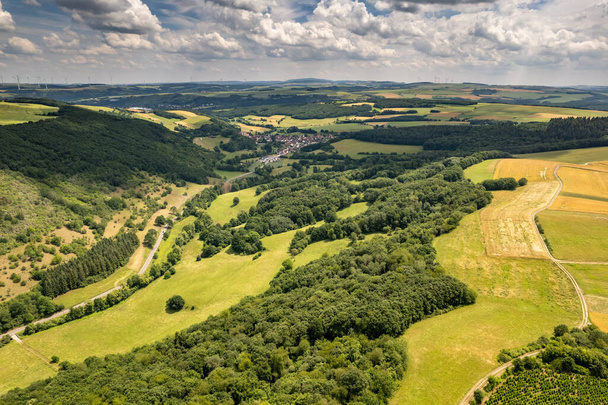 Aerial view of a landscape in Rhineland-Palatinate, Germany on the river Glan with the village Breitenheim in the background - Photo, Image