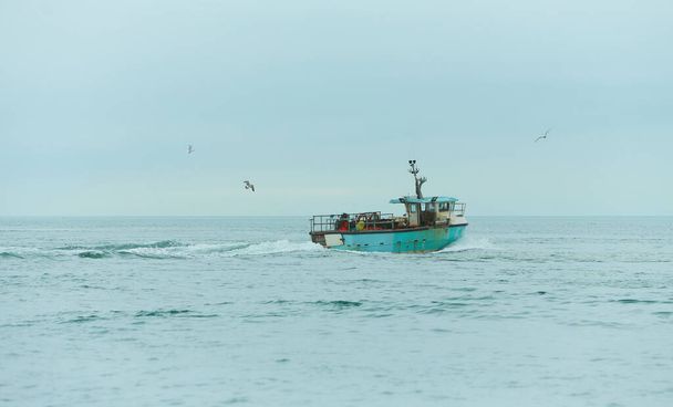 Fishing boat in the open sea. - Photo, Image