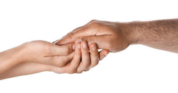 Woman holding hand of mature man on white background, closeup. Support concept - Foto, imagen