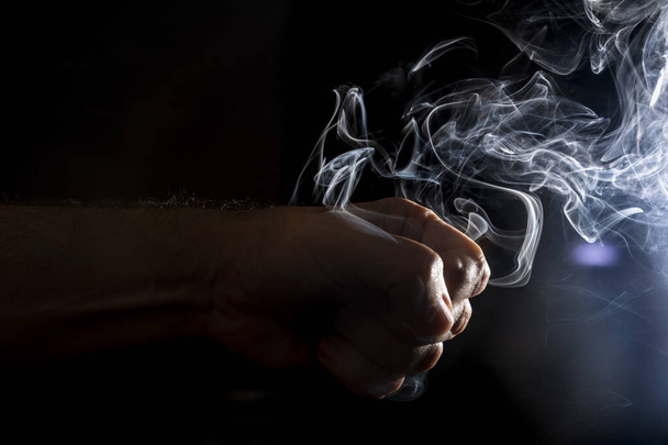 Flavored incense smoke burning. dramatic black background. - Foto, Imagem