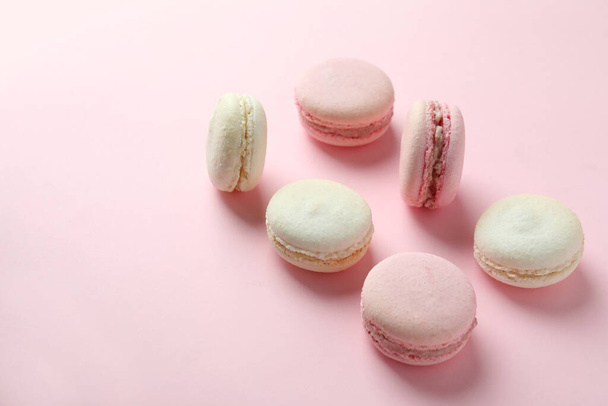 Concept of tasty dessert with macaroons on pink background - Photo, Image