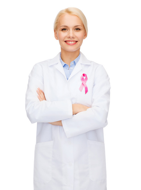 female doctor with breast cancer awareness ribbon - Foto, Imagem