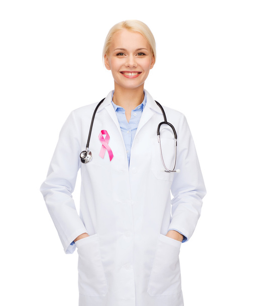 female doctor with breast cancer awareness ribbon - Foto, afbeelding