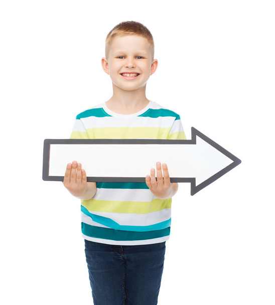 smiling little boy with blank arrow pointing right - Fotografie, Obrázek
